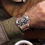 Man wearing a luxury high end watch SX5 in rose gold